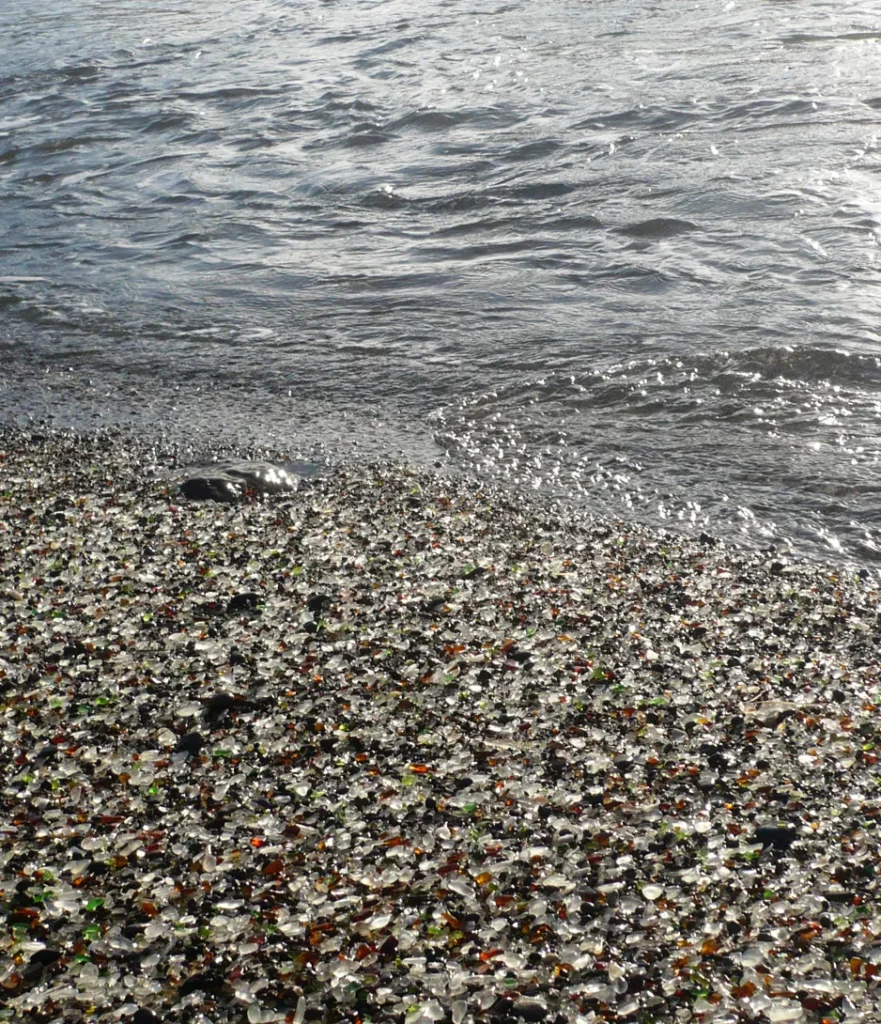 A photograph showing the large amount of sea glass on the shore of Glass Beach.